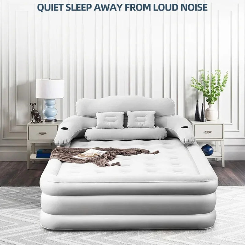 Inflatable double bed set up in a living room