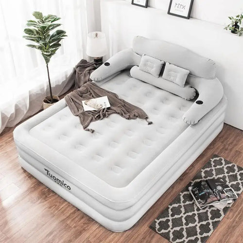 Inflatable double bed with backrest in a bedroom