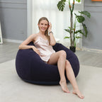 Woman relaxing in the inflatable lazy chair